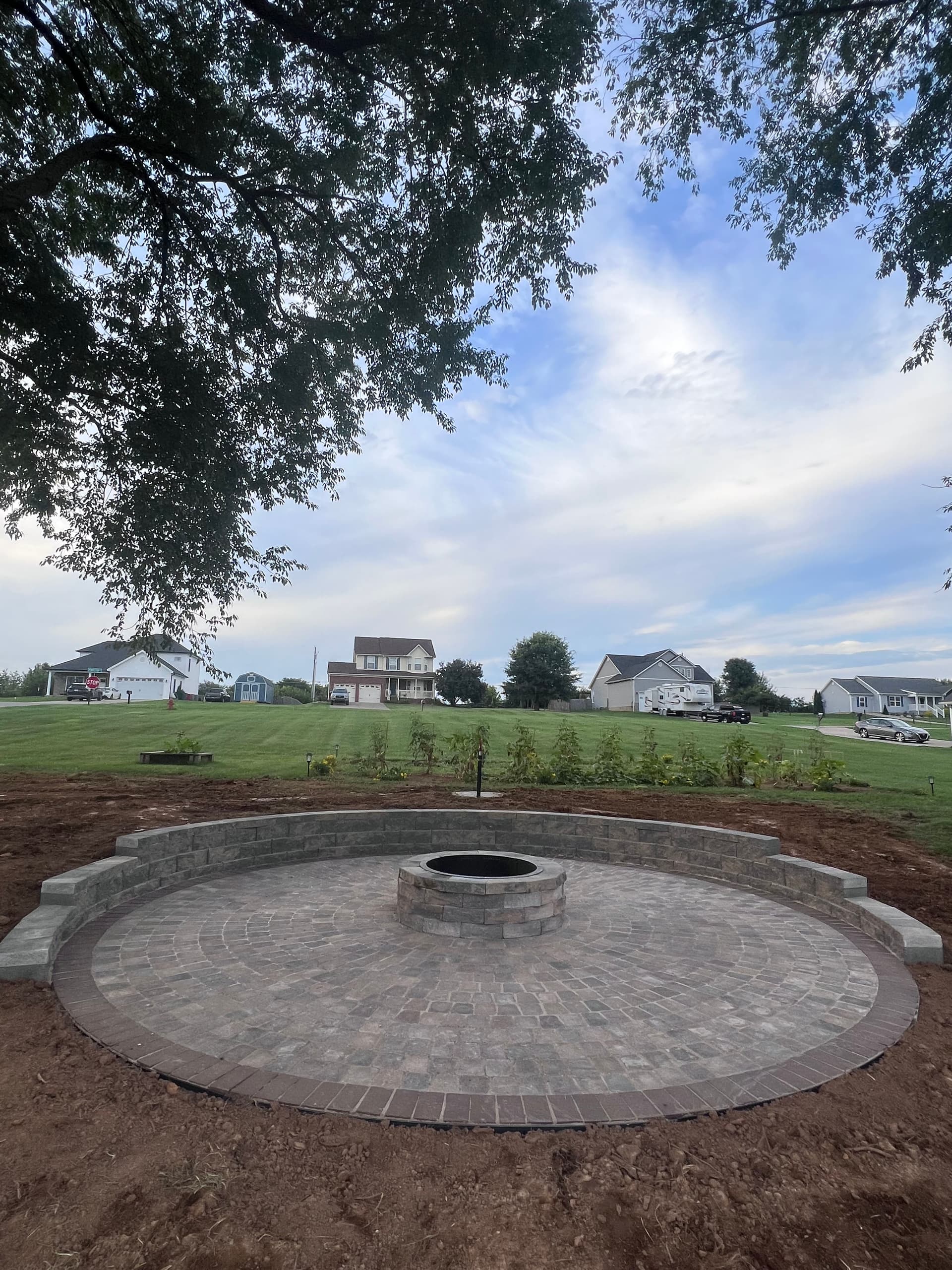 Round Paver Patio with Built-In Fire Pit and Seating Wall image